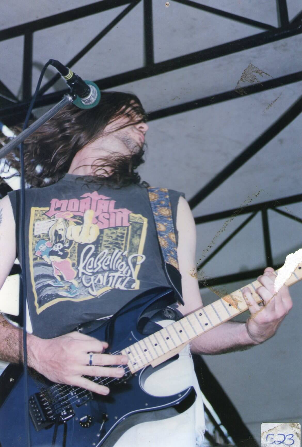 Nikk Carmichael on stage at Manly Beach in the 90s